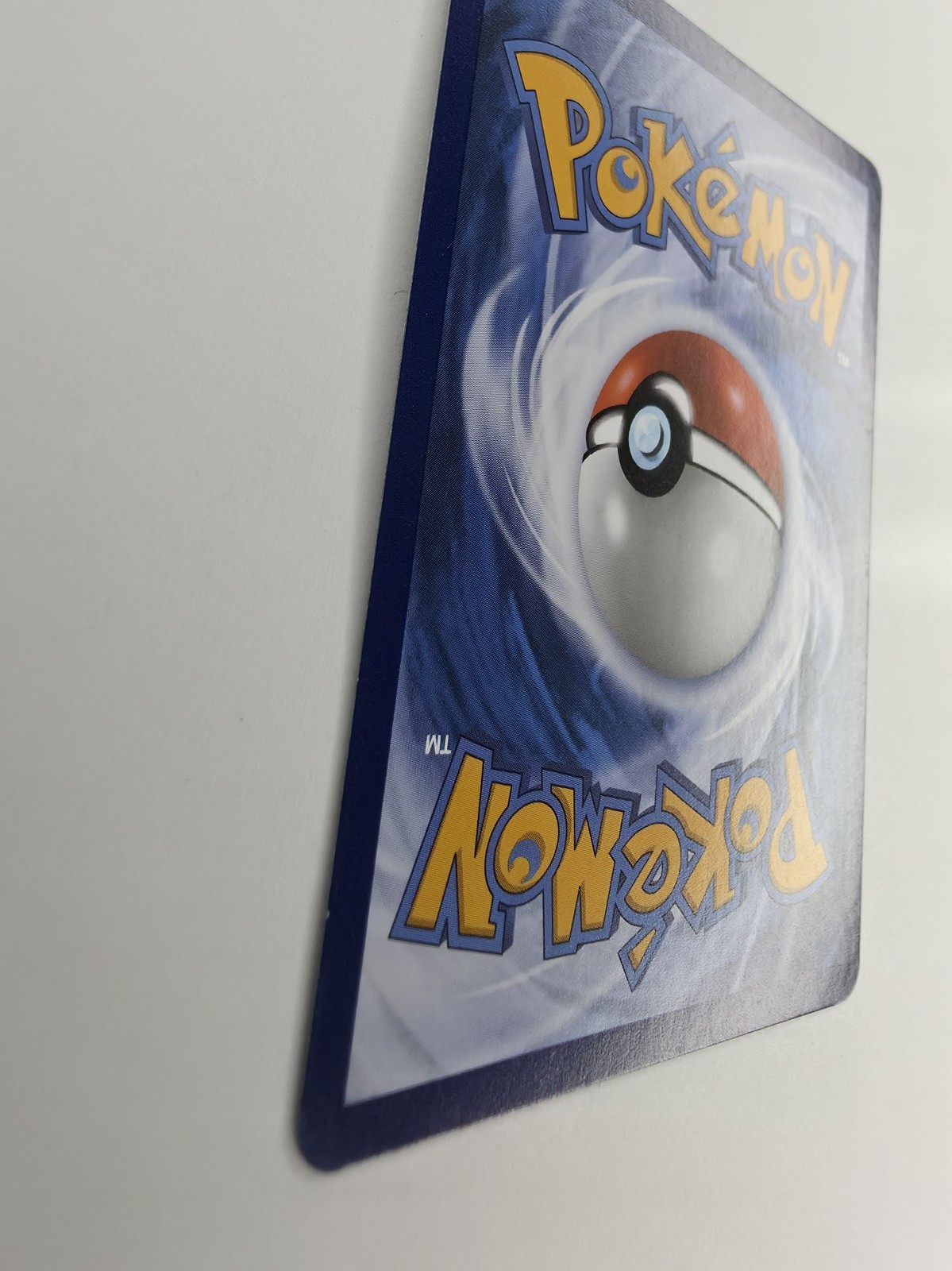 2026 Pokemon Pitch Black Backtrack Badge #074/084 Reverse Holo Uncommon Trainer back at an angle