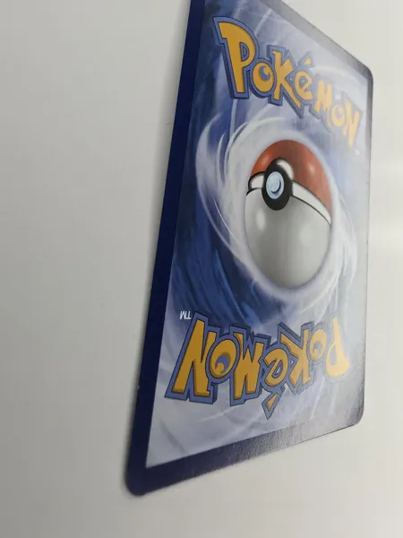 2026 Pokemon Pitch Black Backtrack Badge #074/084 Reverse Holo Uncommon Trainer back at an angle