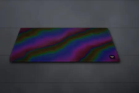 Elemental Holo desk mat, 16 x 32 in, on a desk, angled