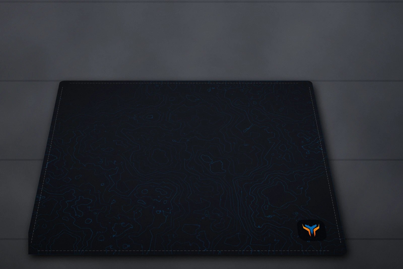 Elemental Topo desk mat, 18 x 16 in, on a desk, angled