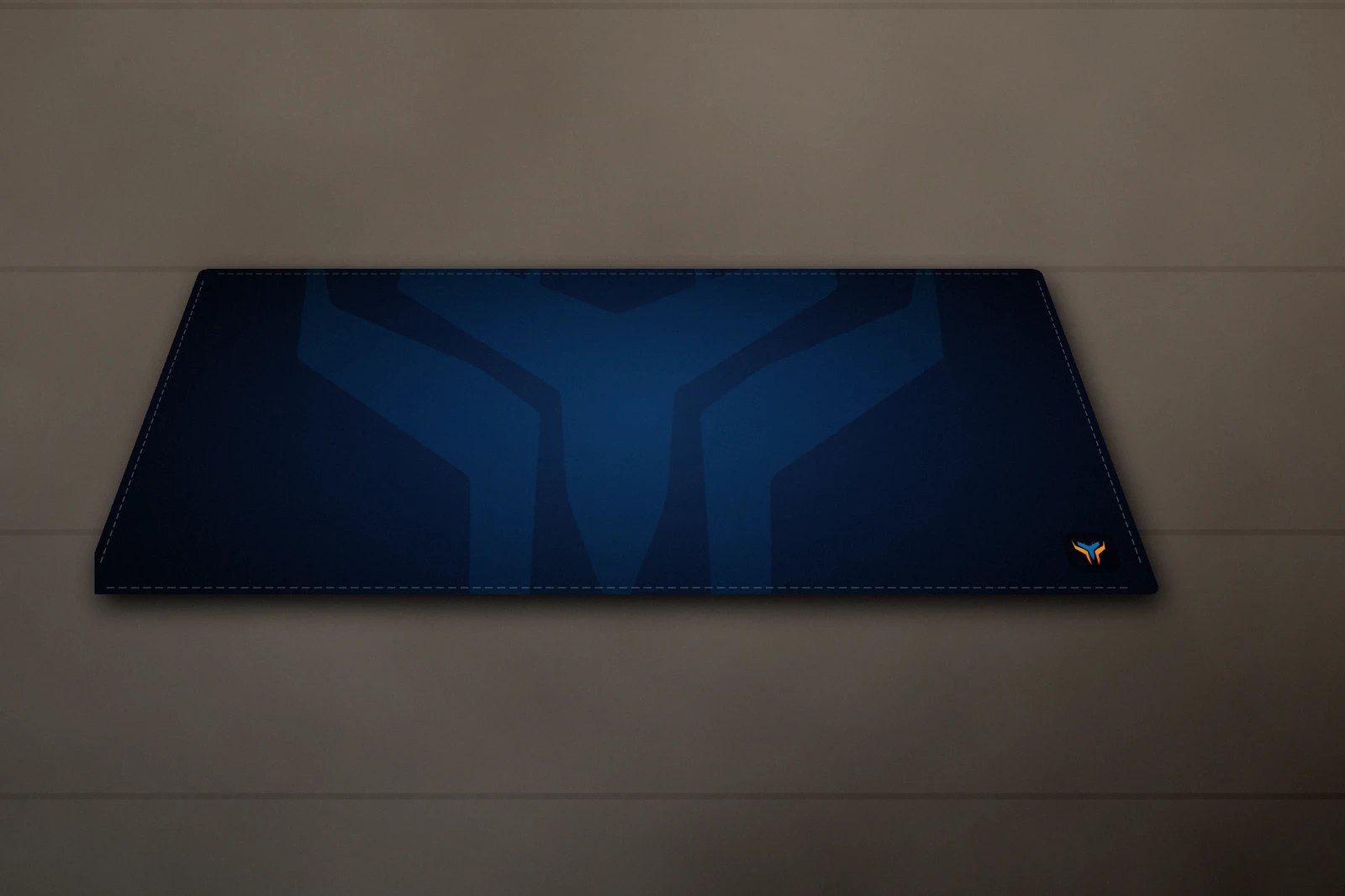 Elemental Wing desk mat, 36 x 18 in, on a desk, angled