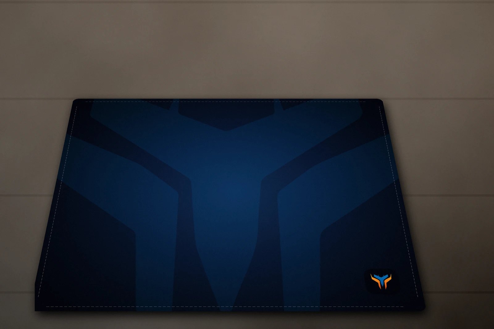 Elemental Wing desk mat, 18 x 16 in, on a desk, angled