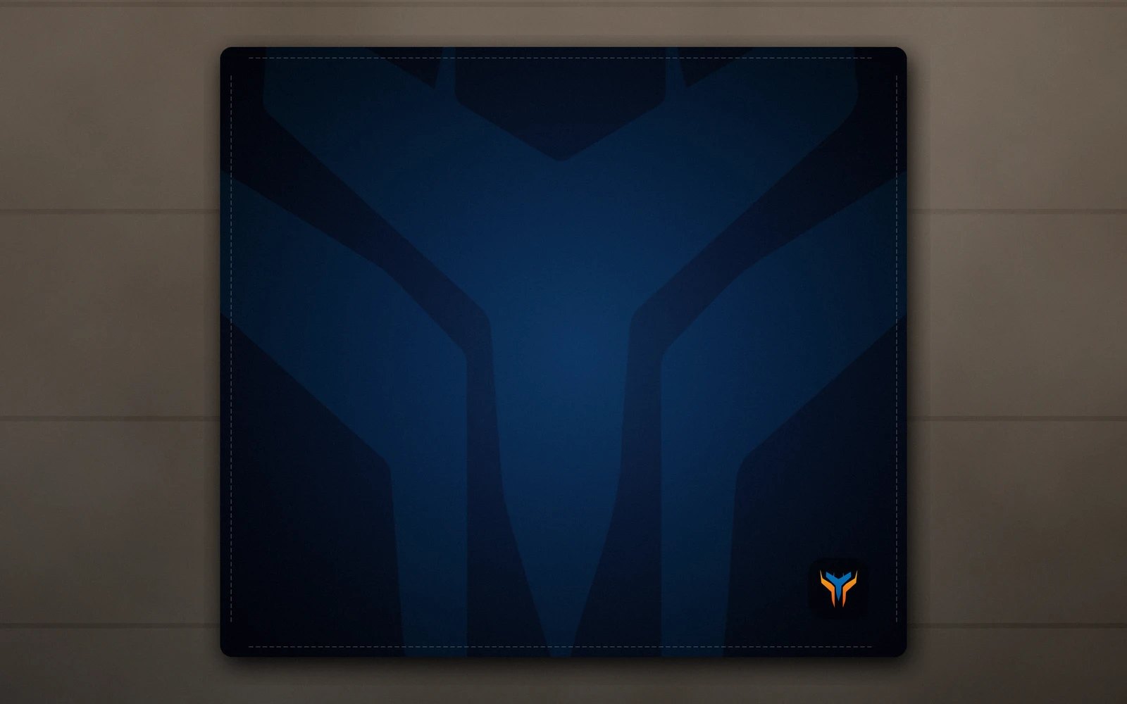Elemental Wing desk mat, 18 x 16 in, on a desk, from above
