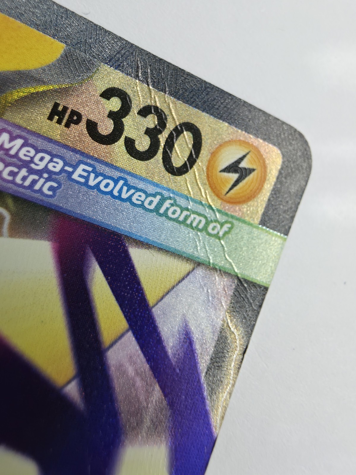 Mega Manectric ex front corner crease