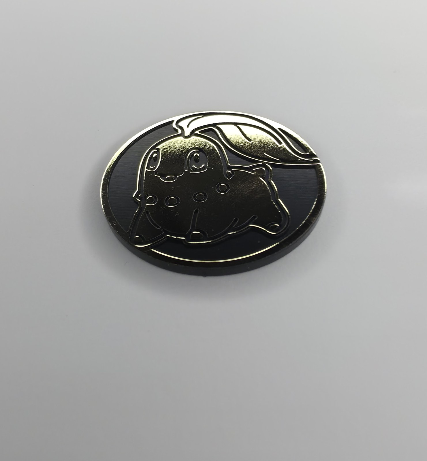 Chikorita coin front, angled