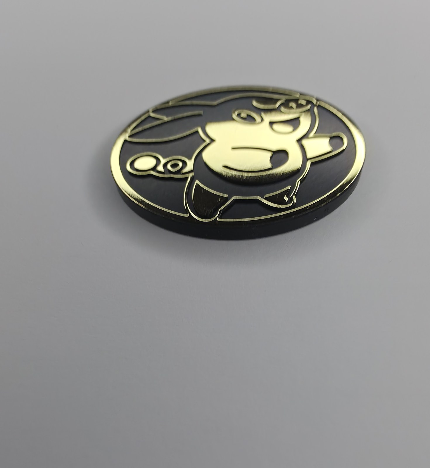 Tepig coin front, angled