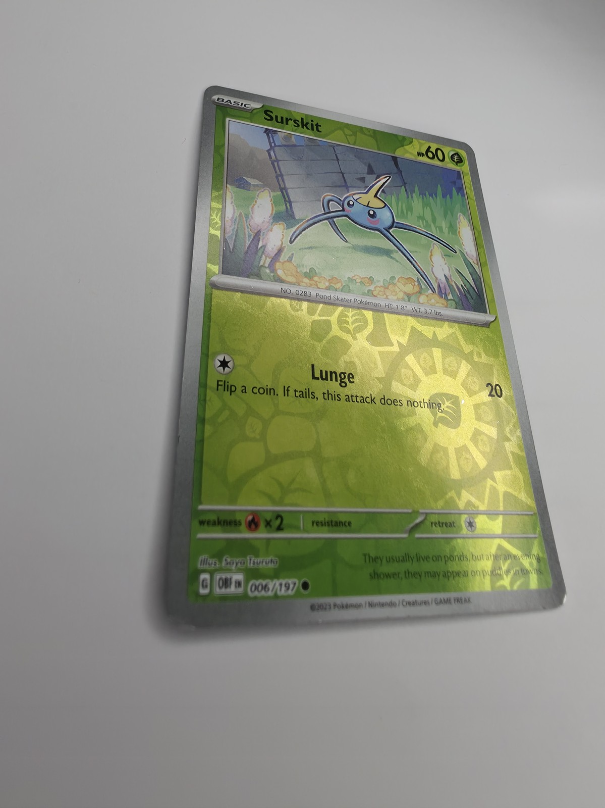 2023 Pokemon Obsidian Flames Surskit #006/197 Reverse Holo front, angled